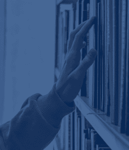 choosing a book from a bookshelf blue